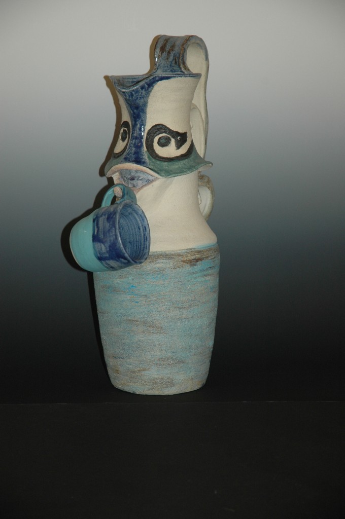 Water Carrier, a wheel thrown pitcher with cup,20″ T, White Stoneware with matte glazes$375.00
